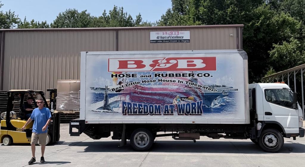 B&B Hose and Rubber Co. delivery truck with Freedom at Work branding outside the Chesapeake warehouse